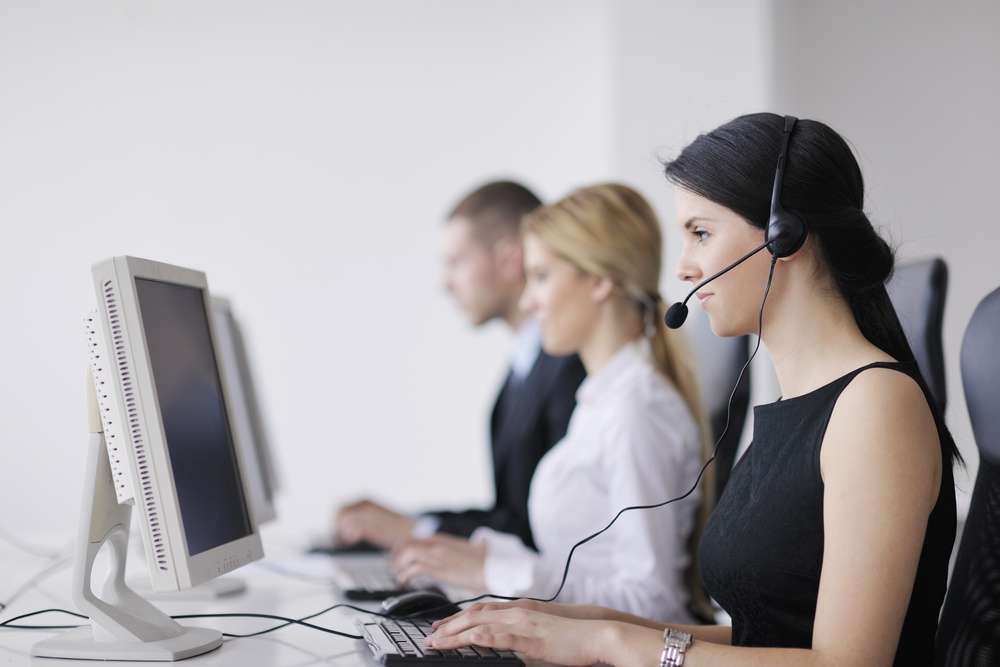 business people group with  headphones giving support in  help desk office to customers, manager giving training and education instructions-1